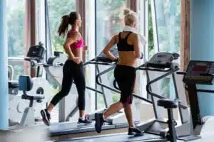 Two women exercising on a treadmill